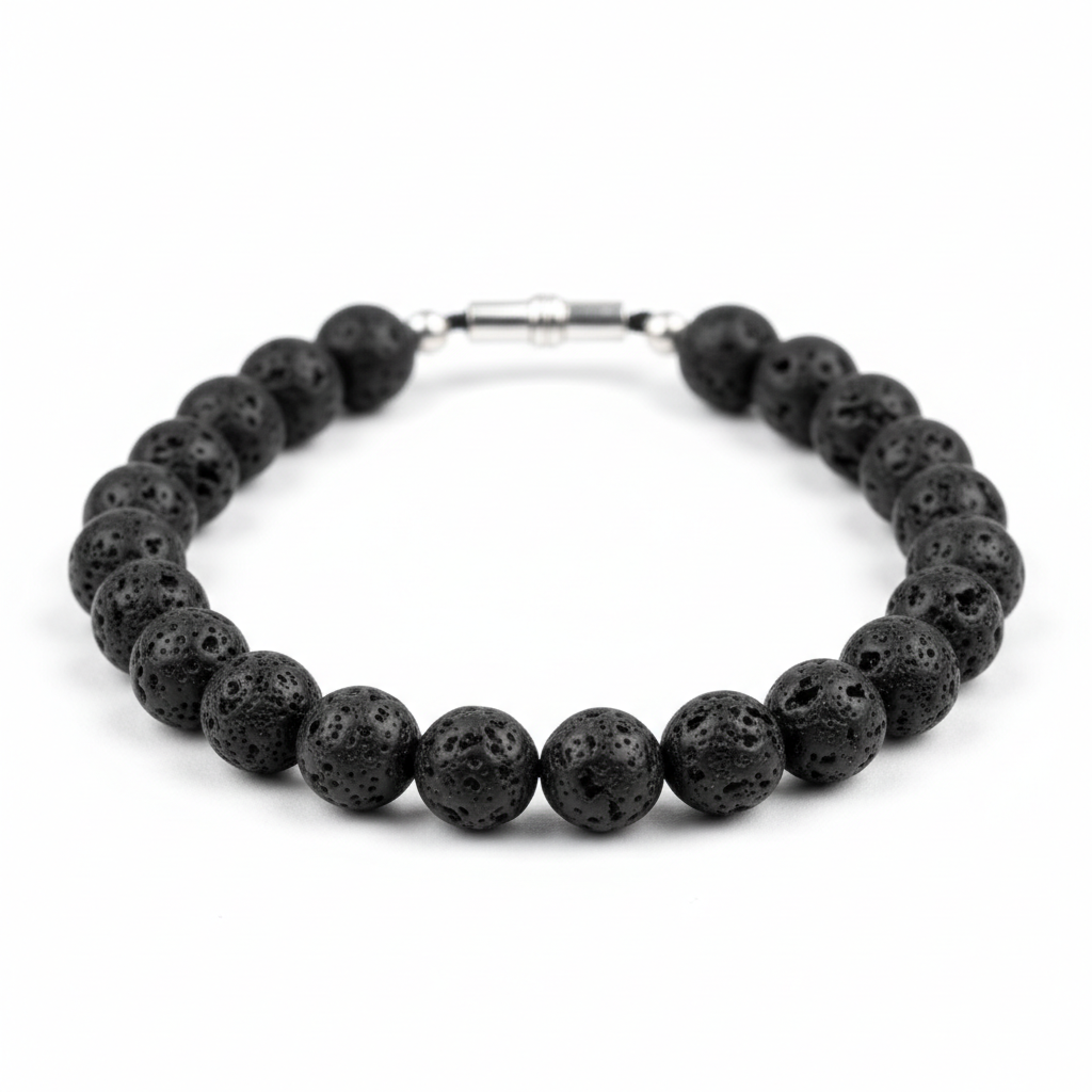 A premium catalog product shot of a finished matte black volcanic rock lava stone beaded necklace with a clean metallic closure on a pure white studio background.
