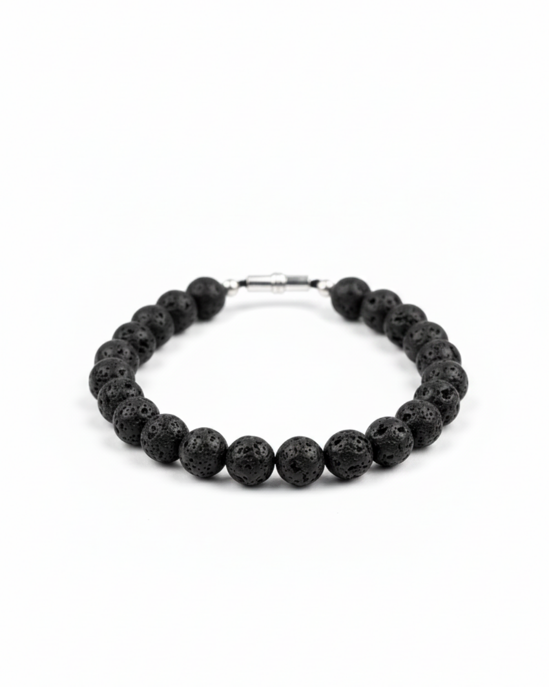 A premium catalog product shot of a finished matte black volcanic rock lava stone beaded necklace with a clean metallic closure on a pure white studio background.