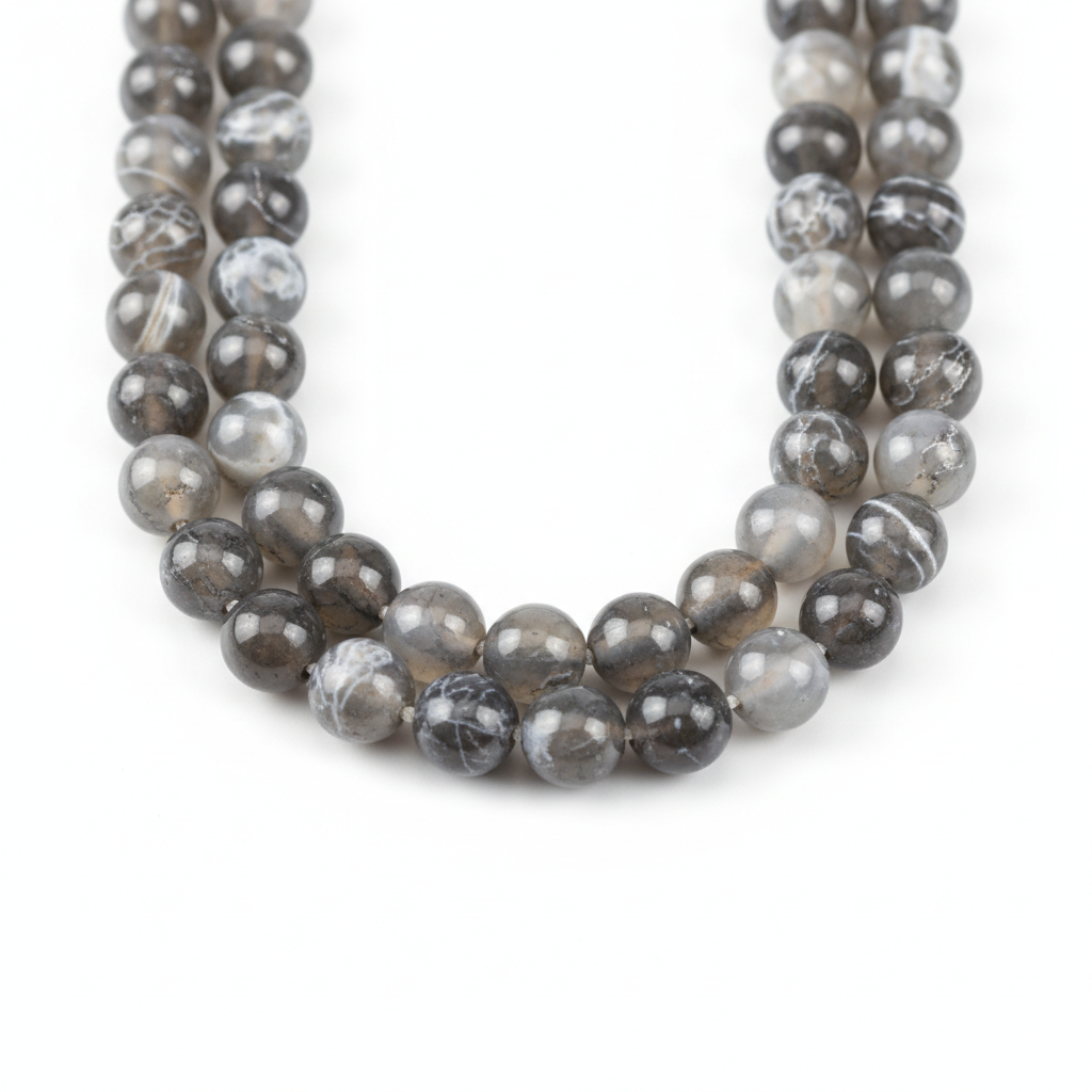Macro studio layout showcasing the unique, matrix-like paths and rich textures of natural Veined Dragon Agate beads.