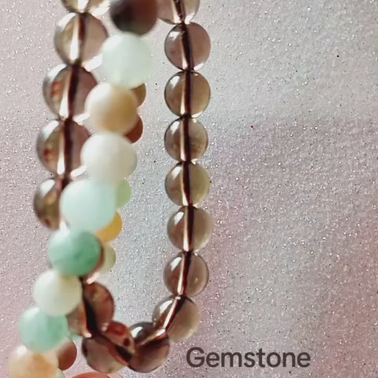 A short-form video preview demonstrating the organic gemstone layering, light refraction, and daily wear styling of a genuine smokey quartz bead bracelet.
